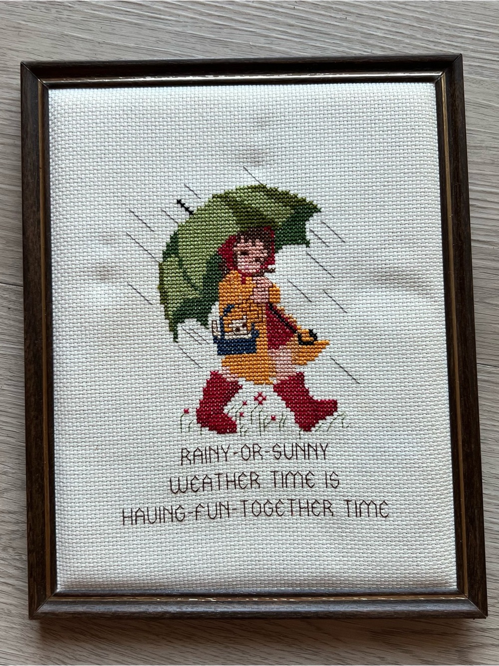 Framed Cross-Stitch Rainy Day Girl Wall Art - Green, Red, Yellow